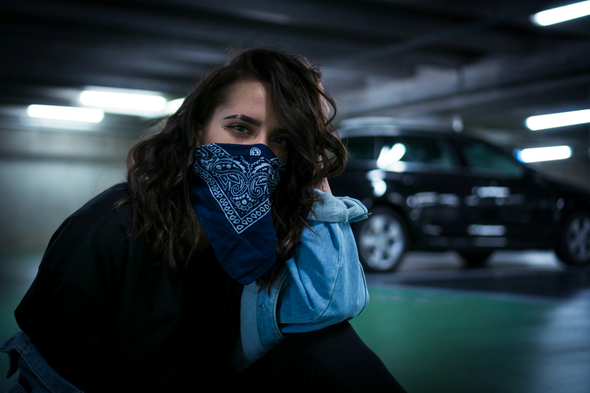 woman wearing bandana across face